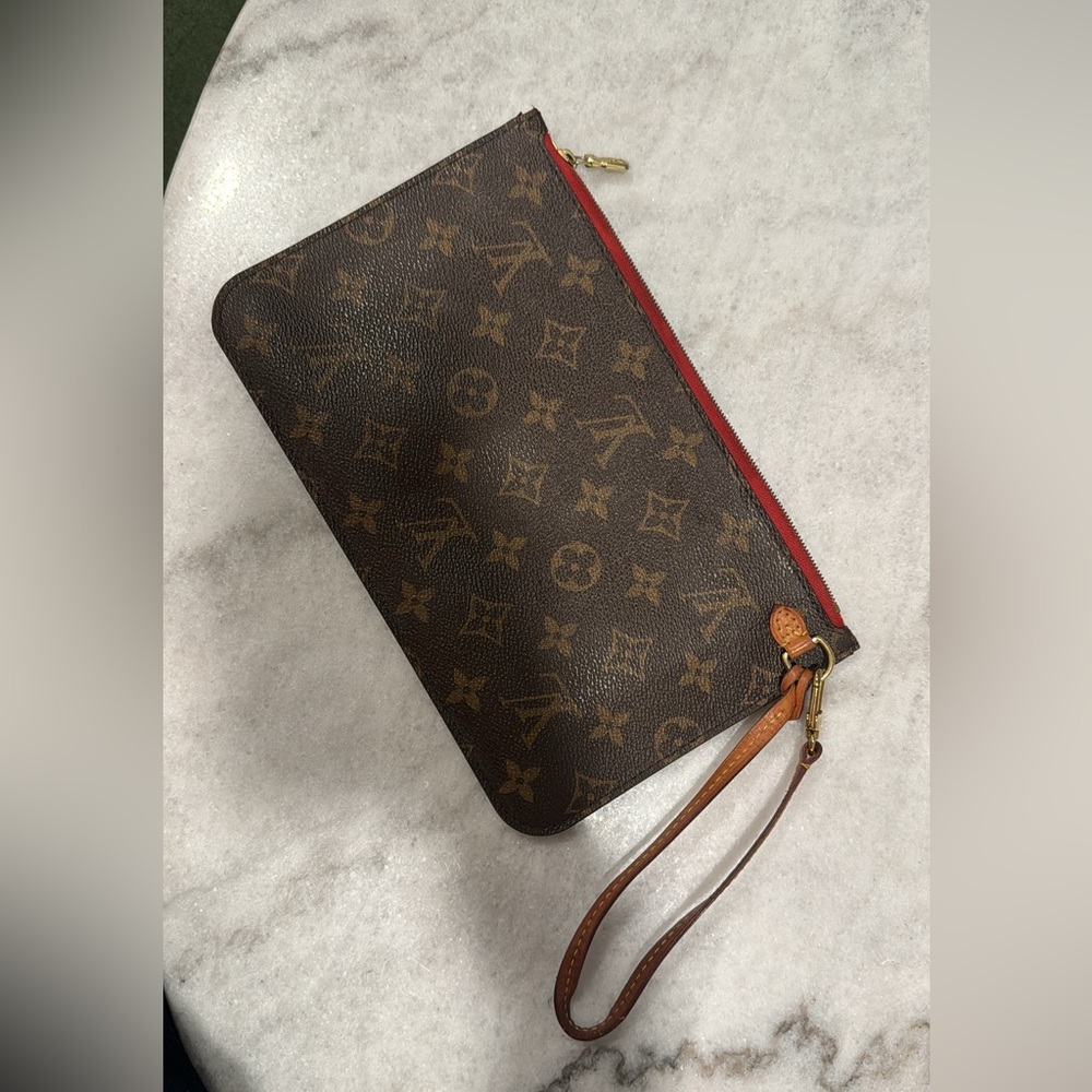 Louis Vuitton Pouch in good condition! Minor stains on the inside.